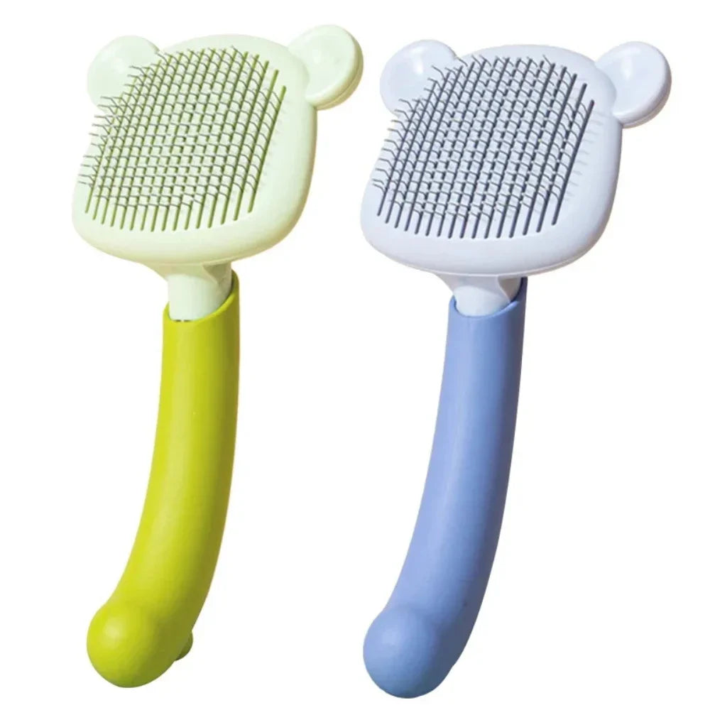 Escovas para gatos com cerdas de aço e cabo longo, design de orelhas, cores verde e azul.