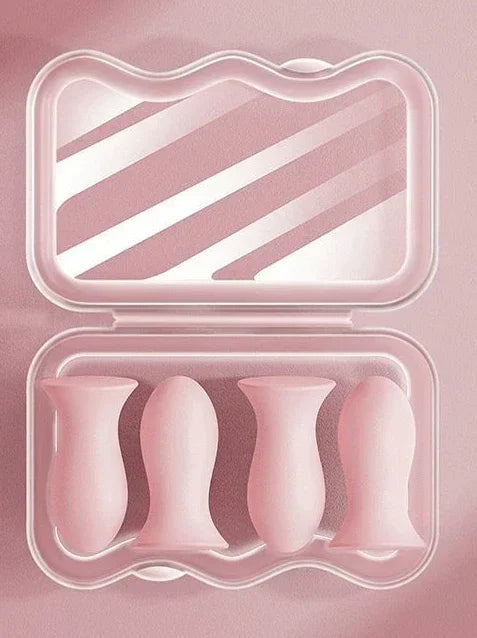 Kit de ventosas de silicone rosa para massagem facial em estojo transparente sobre fundo rosa