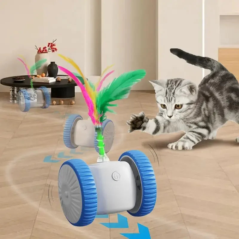 Gato brincando com brinquedo eletrônico para gatos com penas coloridas e rodas azuis em sala.