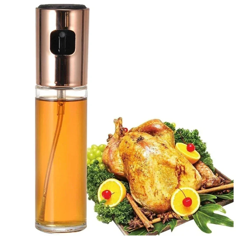 Borrifador de óleo culinário ao lado de frango assado com laranja e cereja em travessa decorada.