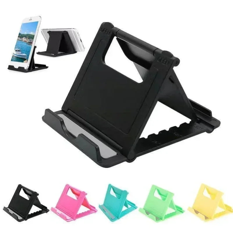 Suporte dobrável para celular em plástico, disponível em várias cores, ideal para mesa.